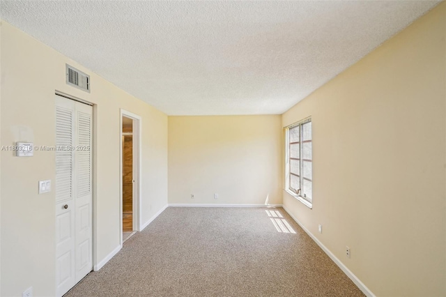 3774 Inverrary Blvd Unit 203P, Lauderhill, FL 33319 - unfurnished bedroom featuring carpet flooring, a textured ceiling, and a closet