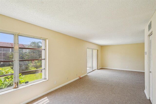 3774 Inverrary Blvd Unit 203P, Lauderhill, FL 33319 - carpeted spare room with healthy amount of natural light and a textured ceiling