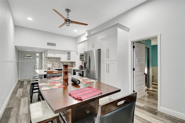 8113 SW 22nd Ct Unit 150, Davie, FL 33324 - dining space with ceiling fan, baseboards, light wood-style flooring, and recessed lighting