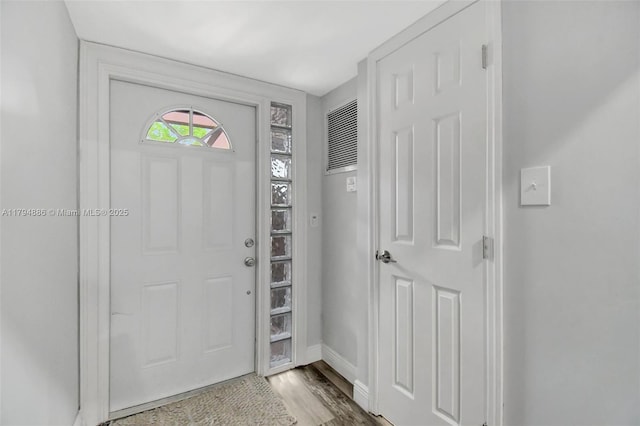 8113 SW 22nd Ct Unit 150, Davie, FL 33324 - foyer featuring wood finished floors and baseboards