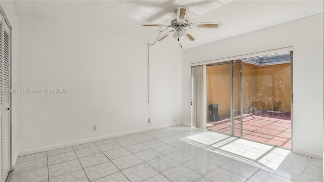 2309 SW 81st Ter Unit 5, North Lauderdale, FL 33068 - unfurnished bedroom featuring light tile patterned floors, a ceiling fan, and baseboards