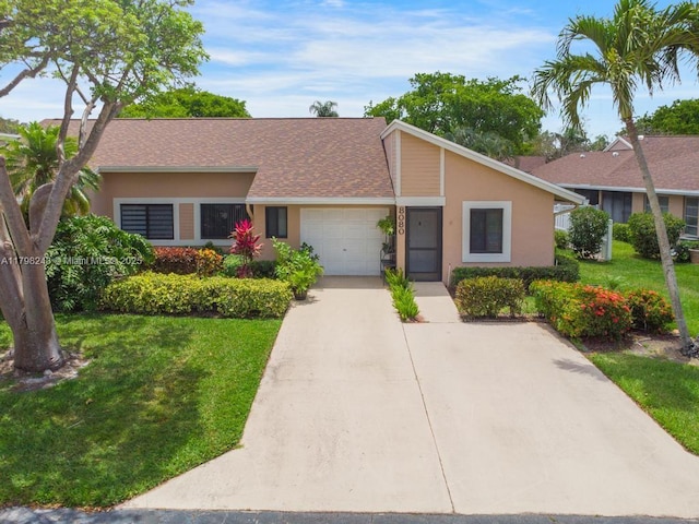 8080 Sweetbriar Way, Boca Raton, FL 33496 - view of front of property with concrete driveway, a front yard, an attached garage, and stucco siding