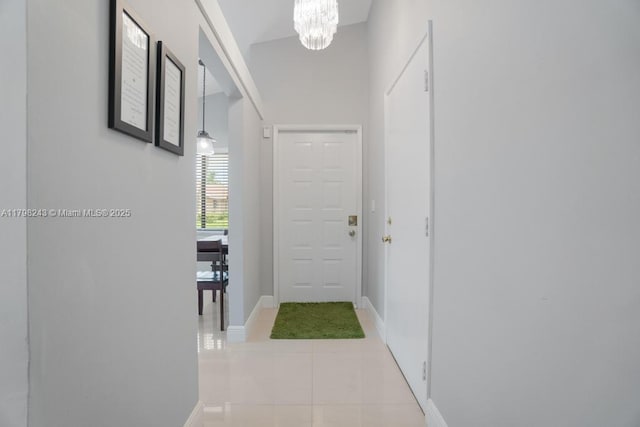 8080 Sweetbriar Way, Boca Raton, FL 33496 - corridor with a chandelier, baseboards, and tile patterned floors