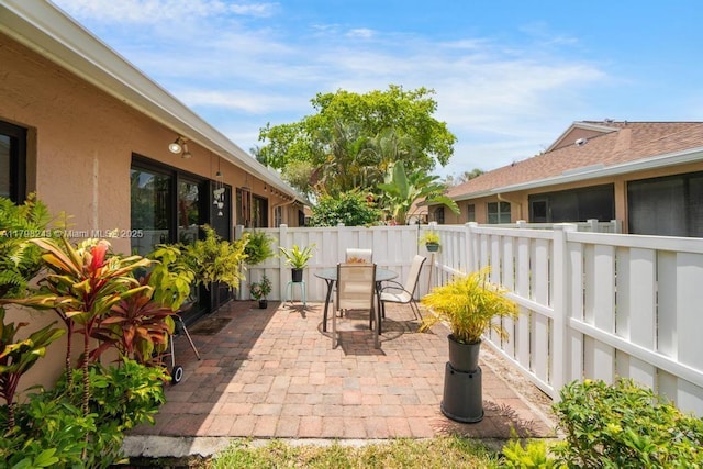 8080 Sweetbriar Way, Boca Raton, FL 33496 - view of patio featuring outdoor dining area and a fenced backyard