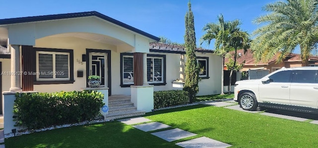155 W 60th St, Hialeah, FL 33012 - view of front of home featuring stucco siding and a front lawn