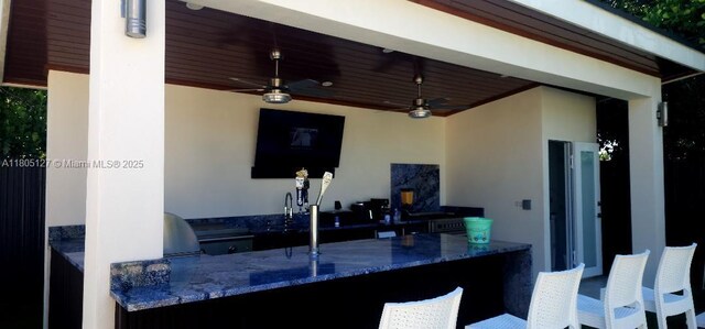 155 W 60th St, Hialeah, FL 33012 - view of patio featuring exterior kitchen and a ceiling fan