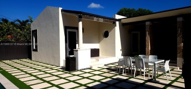 155 W 60th St, Hialeah, FL 33012 - view of patio featuring outdoor dining space