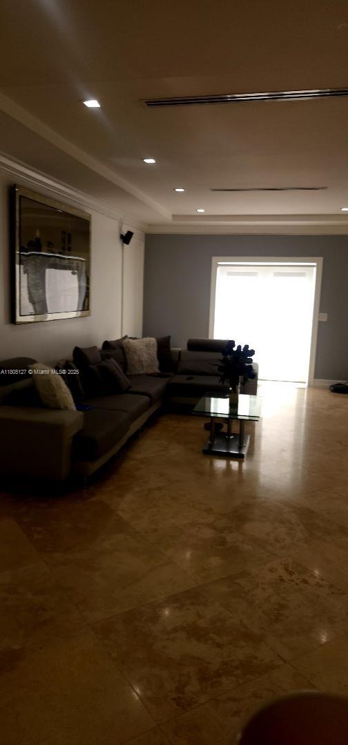 155 W 60th St, Hialeah, FL 33012 - living room featuring a tray ceiling and recessed lighting