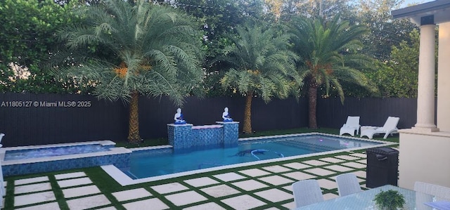 155 W 60th St, Hialeah, FL 33012 - view of pool with a fenced backyard, a patio area, and a pool with connected hot tub