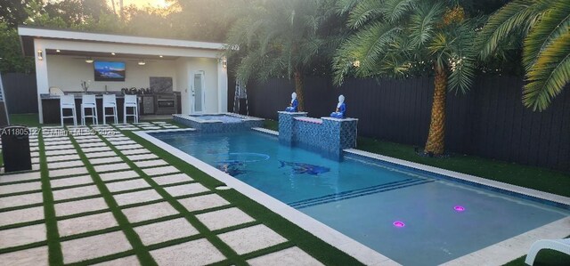 155 W 60th St, Hialeah, FL 33012 - view of pool with a pool with connected hot tub and a patio