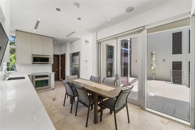 544 Fernwood Rd Unit 544, Key Biscayne, FL 33149 - dining area with french doors and light marble finish floors