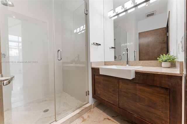 544 Fernwood Rd Unit 544, Key Biscayne, FL 33149 - bathroom with marble finish flooring, a shower stall, and vanity