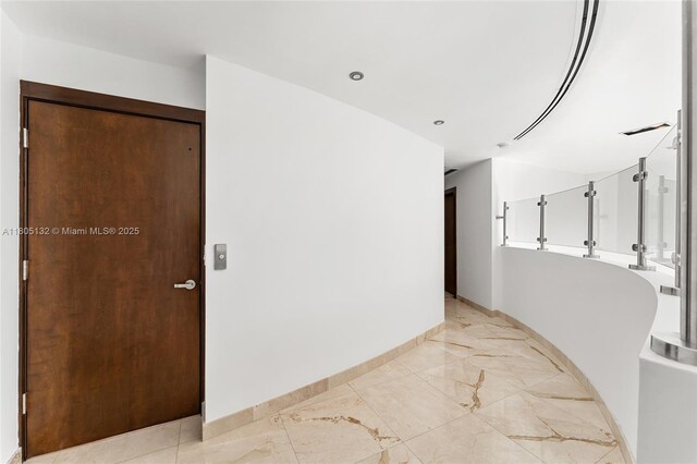 544 Fernwood Rd Unit 544, Key Biscayne, FL 33149 - unfurnished room with baseboards, light marble finish flooring, and recessed lighting