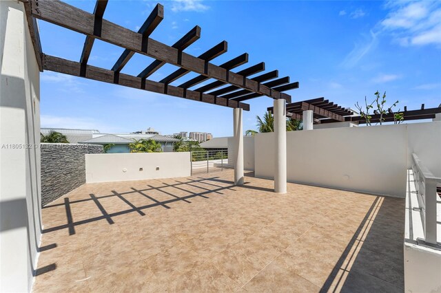 544 Fernwood Rd Unit 544, Key Biscayne, FL 33149 - view of patio featuring a pergola and fence
