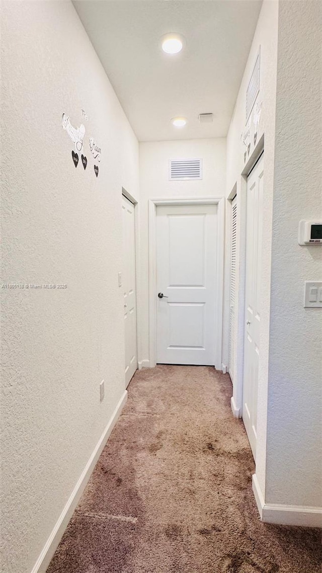 21463 NE 3rd Path, Miami, FL 33179 - corridor featuring carpet flooring, baseboards, a textured wall, and recessed lighting
