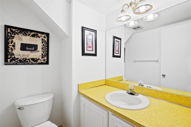 50 Matador Ln Unit 3-23, Davie, FL 33324 - bathroom featuring toilet, vanity, and a chandelier