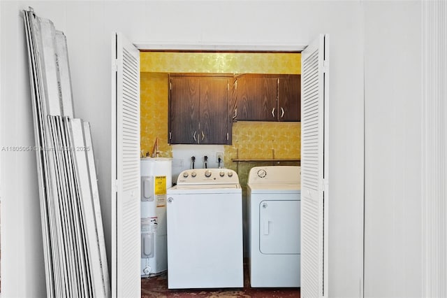 50 Matador Ln Unit 3-23, Davie, FL 33324 - laundry room featuring water heater, washer and clothes dryer, and cabinet space