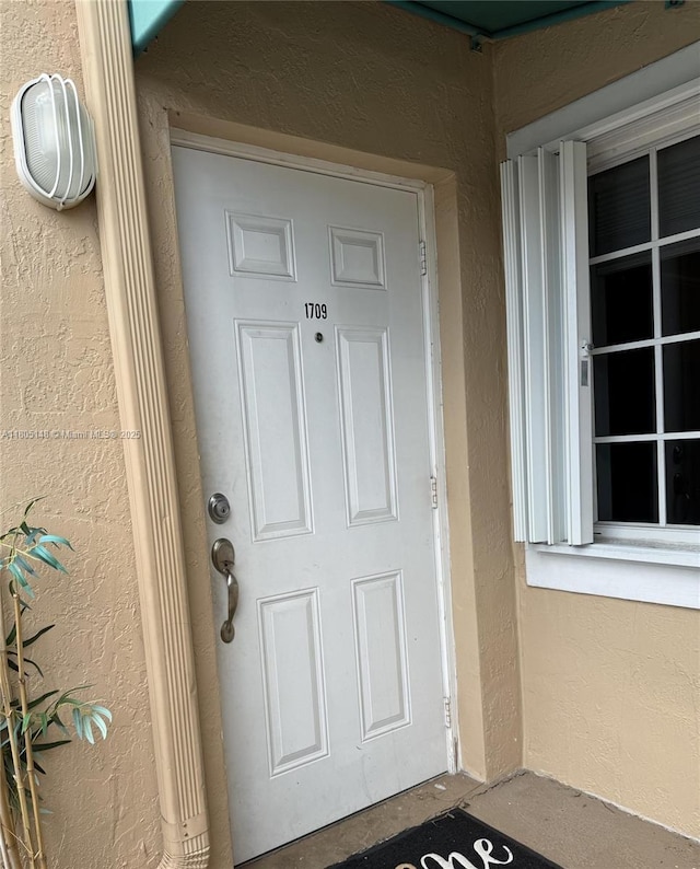 6416 SW 131st Path Unit 1709, Miami, FL 33183 - doorway to property featuring stucco siding