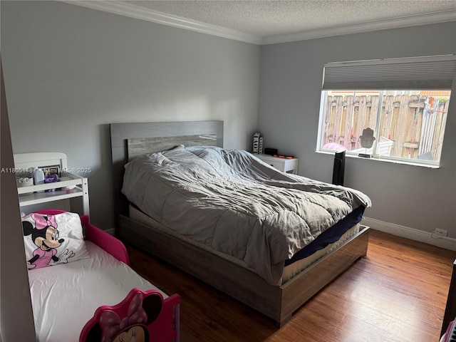 6416 SW 131st Path Unit 1709, Miami, FL 33183 - bedroom with crown molding, a textured ceiling, wood finished floors, and baseboards