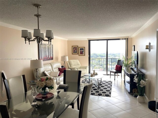 2625 Collins Ave Unit 1409, Miami Beach, FL 33140 - dining area with crown molding, a chandelier, a textured ceiling, expansive windows, and light tile patterned floors