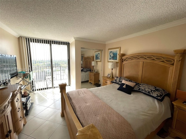 2625 Collins Ave Unit 1409, Miami Beach, FL 33140 - bedroom featuring access to outside, a textured ceiling, light tile patterned floors, and ornamental molding