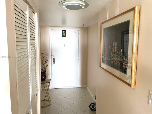 2625 Collins Ave Unit 1409, Miami Beach, FL 33140 - foyer featuring light tile patterned floors and baseboards