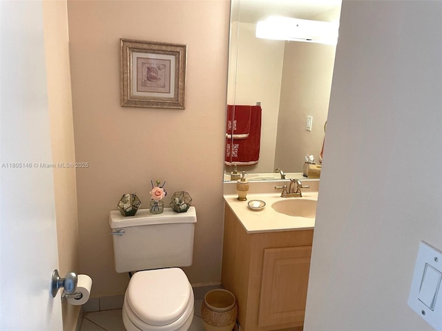 2625 Collins Ave Unit 1409, Miami Beach, FL 33140 - bathroom featuring toilet, vanity, and tile patterned flooring