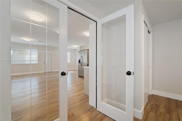 bathroom featuring wood finished floors and baseboards