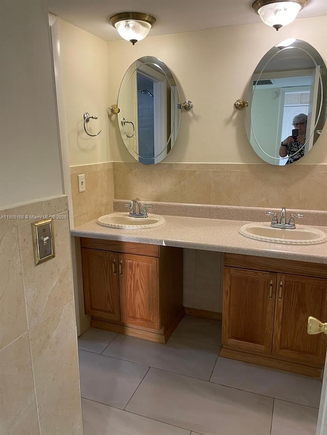 1670 Forest Lakes Cir Unit C, West Palm Beach, FL 33406 - full bath with tile walls, tile patterned floors, a wainscoted wall, and double vanity