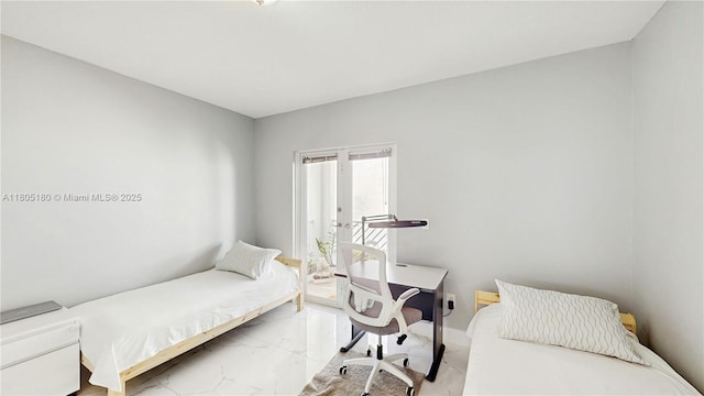 931 SW 11th St Unit H-1, Miami, FL 33129 - bedroom with light marble finish floors, french doors, and baseboards