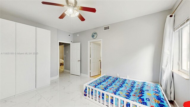 931 SW 11th St Unit H-1, Miami, FL 33129 - bedroom featuring light marble finish flooring, multiple windows, ceiling fan, and baseboards