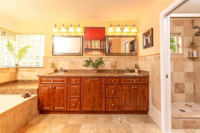 15332 SW 142nd Ter, Miami, FL 33196 - bathroom featuring tile walls, a garden tub, double vanity, and a tile shower