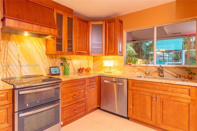 15332 SW 142nd Ter, Miami, FL 33196 - kitchen featuring appliances with stainless steel finishes, custom range hood, light stone counters, and backsplash