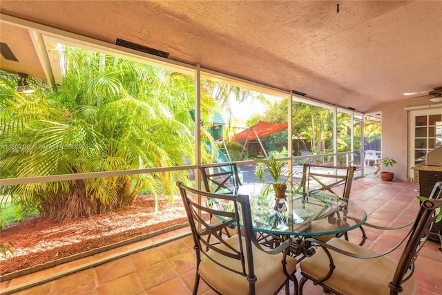 15332 SW 142nd Ter, Miami, FL 33196 - sunroom / solarium featuring outdoor dining space, tile patterned flooring, a textured ceiling, and a ceiling fan