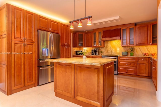 15332 SW 142nd Ter, Miami, FL 33196 - kitchen featuring stainless steel appliances, a kitchen island, brown cabinetry, and custom range hood