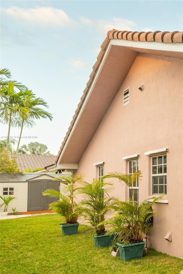 15332 SW 142nd Ter, Miami, FL 33196 - view of grassy yard featuring a storage shed