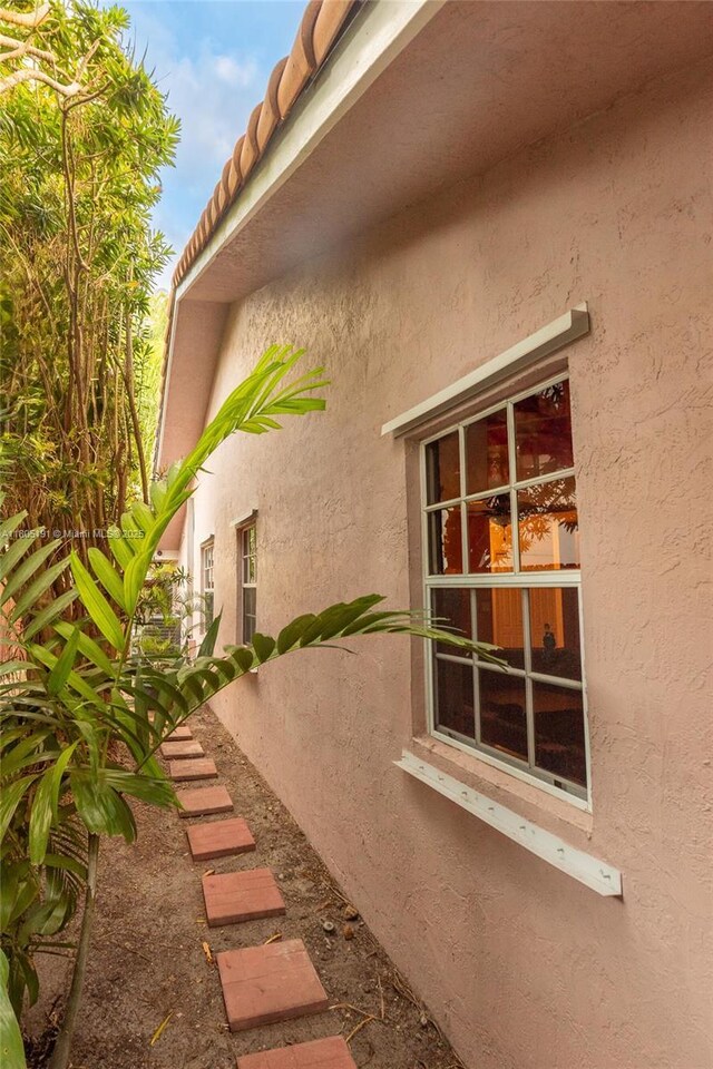 15332 SW 142nd Ter, Miami, FL 33196 - view of side of property featuring stucco siding and a tile roof