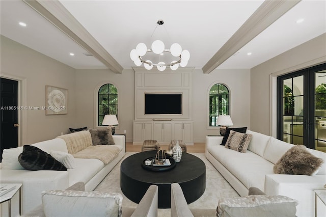 549 NE 59th St, Miami, FL 33137 - living room with beamed ceiling, a chandelier, light wood-style floors, recessed lighting, and french doors