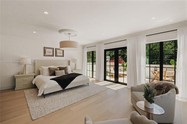 549 NE 59th St, Miami, FL 33137 - bedroom featuring access to exterior, light wood-style flooring, and recessed lighting