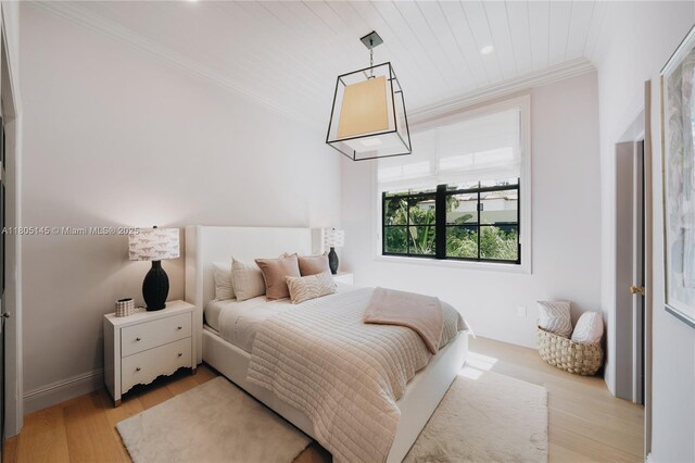 549 NE 59th St, Miami, FL 33137 - bedroom with crown molding, light wood-style flooring, and recessed lighting
