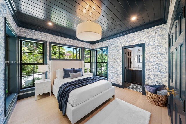549 NE 59th St, Miami, FL 33137 - bedroom with wallpapered walls, crown molding, light wood finished floors, baseboards, and wood ceiling