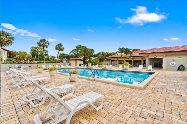 community pool featuring a patio area