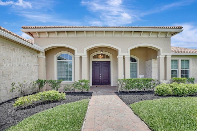 5474 S Sterling Ranch Cir, Davie, FL 33314 - property entrance with stucco siding, a tile roof, and stone siding