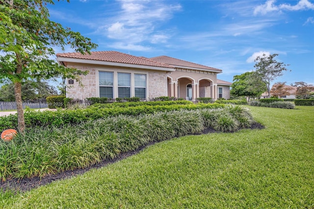 5474 S Sterling Ranch Cir, Davie, FL 33314 - mediterranean / spanish-style house featuring stone siding, a tile roof, and stucco siding