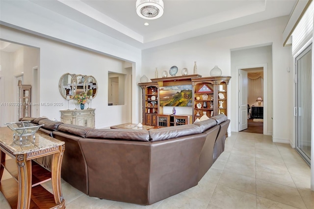 5474 S Sterling Ranch Cir, Davie, FL 33314 - living room featuring light tile patterned floors and a raised ceiling
