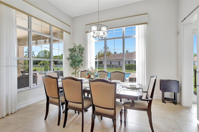 5474 S Sterling Ranch Cir, Davie, FL 33314 - dining room with a chandelier, light tile patterned flooring, and baseboards