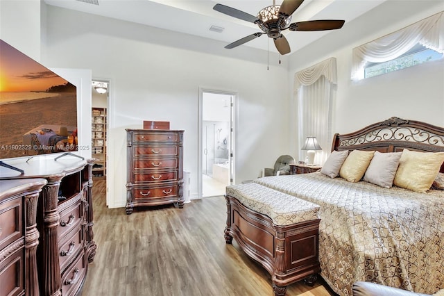 5474 S Sterling Ranch Cir, Davie, FL 33314 - bedroom with light wood finished floors, ensuite bath, and ceiling fan