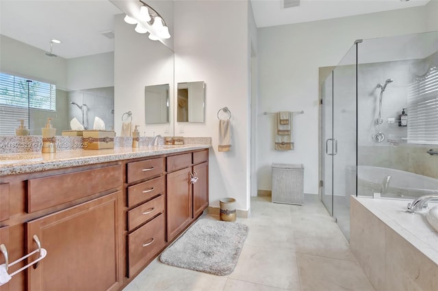 5474 S Sterling Ranch Cir, Davie, FL 33314 - full bath featuring a shower stall, a bath, double vanity, tile patterned flooring, and baseboards