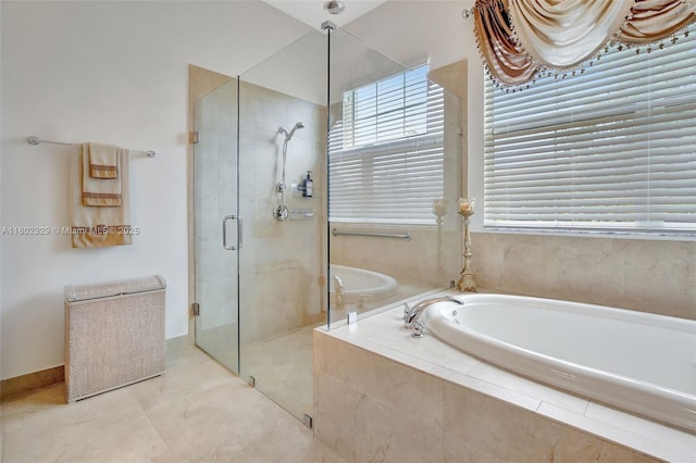 5474 S Sterling Ranch Cir, Davie, FL 33314 - bathroom with a stall shower, a garden tub, and tile patterned floors