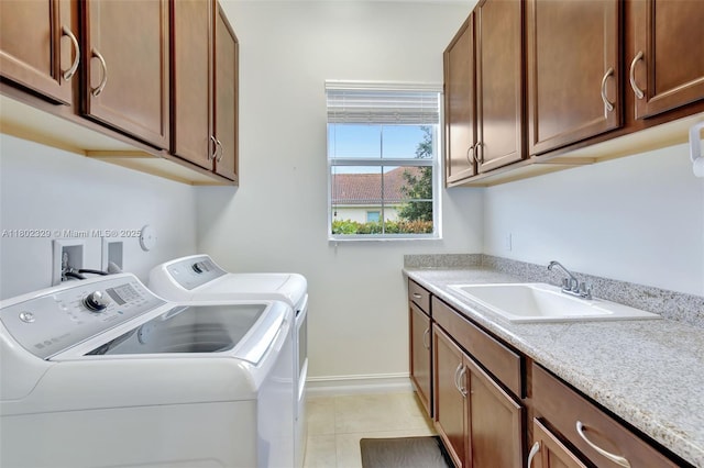 5474 S Sterling Ranch Cir, Davie, FL 33314 - laundry room with washing machine and clothes dryer, cabinet space, baseboards, and light tile patterned floors